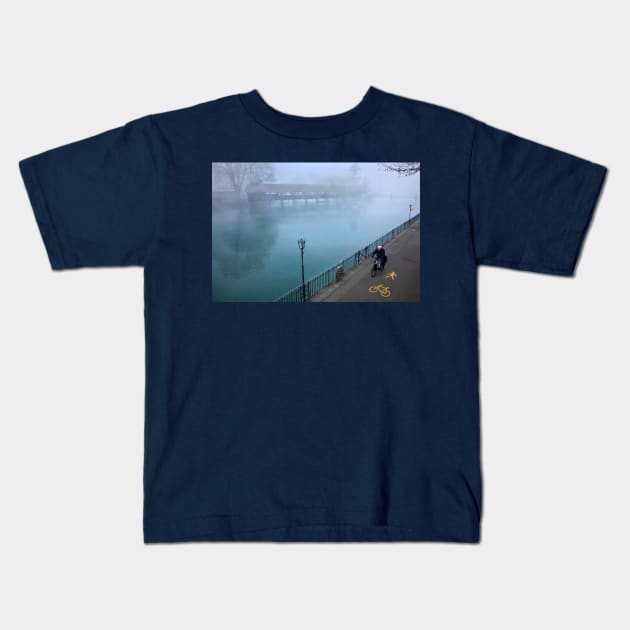 Cycling by the river Kids T-Shirt by Cretense72